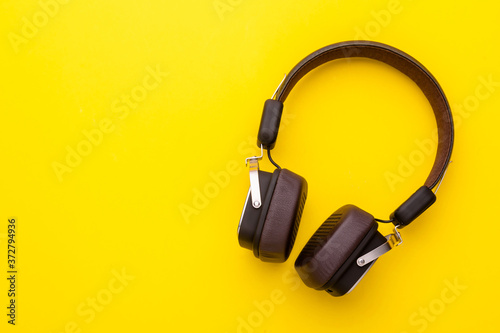 Black Headphone or Headset on bright color background. Copy space for text or design