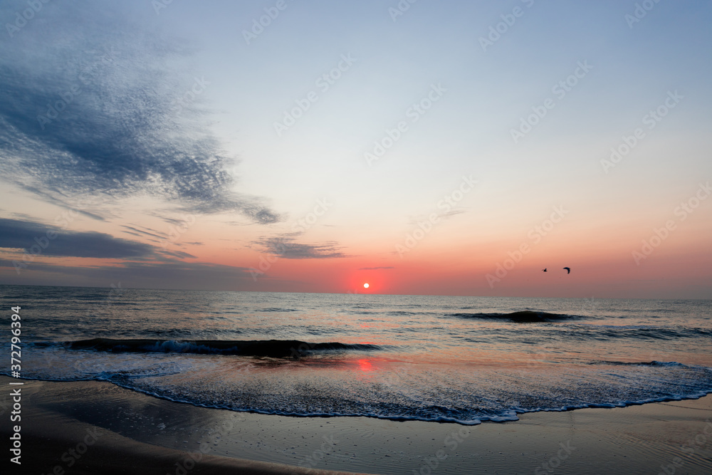 Obraz premium Sunrise on the beach