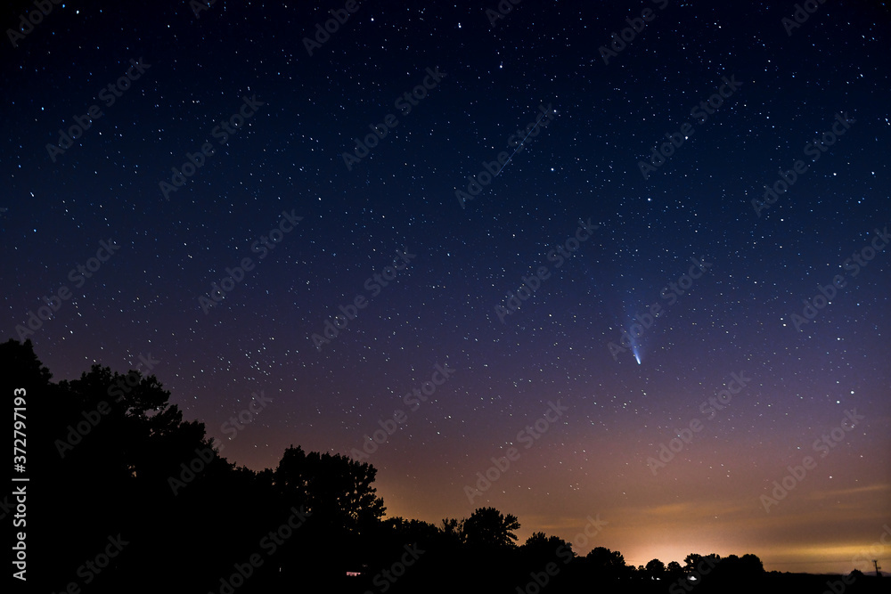Comet Neowise, an astronomical phenomenon the passage of a comet in front of the constellation Ursa Major.