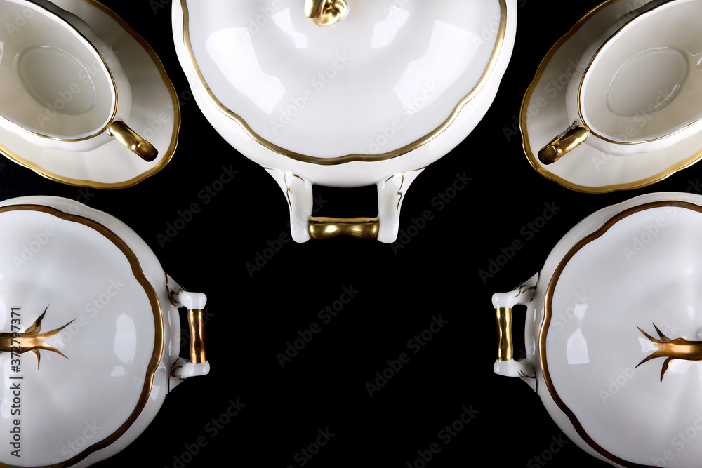 porcelain tableware on dark background top view with copy space