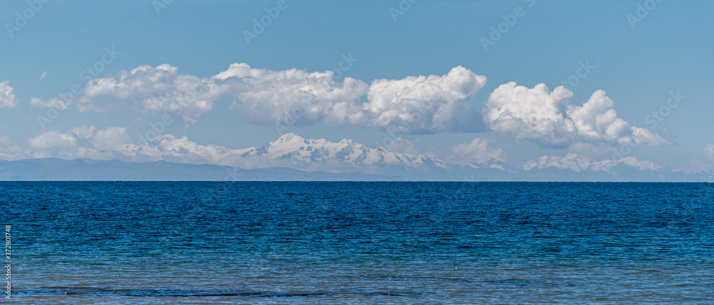 Obraz premium View Across Lake Titicaca into the Bolivian Andes Mountain Range