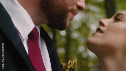 Closeup of Young Bride and Groom: Happy couple goof off to camera