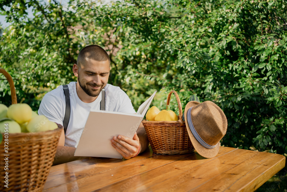 man holding a basket of apples