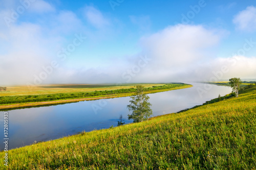 The river ,cloudscape and morning fog in the grassland.