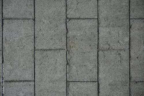 Concrete bricks rough surface gray color background