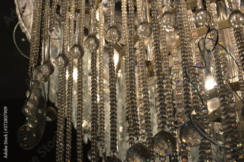 Clear transparent gem beads hanging on the chandelier light