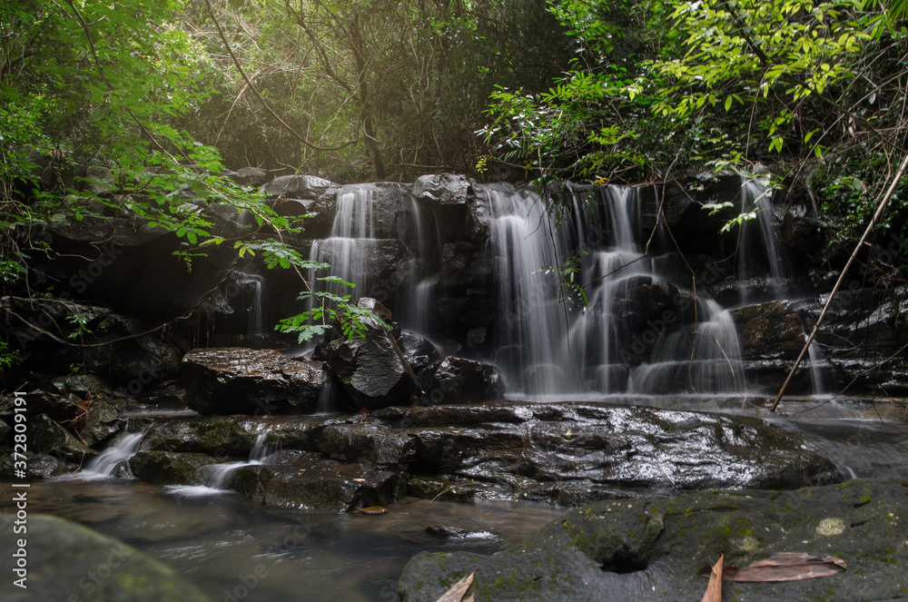Naklejka premium Beautiful waterfall in green forest in jungle, Wangtakang waterfall, Prachinburi, Thailand.