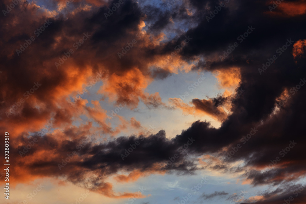 Orange-black close-up sunset clouds