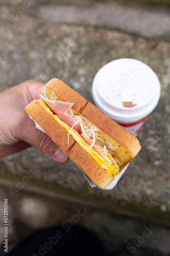 Canvas Print Hand holding South Korean style sandwiches,South Korea street food