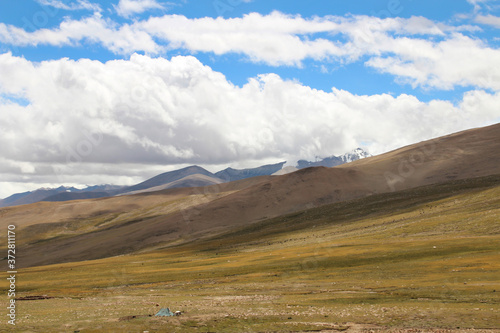 View of the mountains and dramatic sky near Tingri on the way to Everest Base Camp, Tibet, China photo