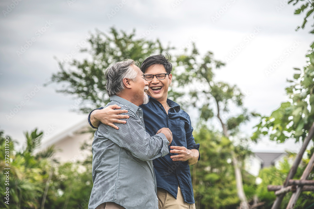 Father and son, embracing and talking happily, asian family Father and son, embracing and talking happily, asian family