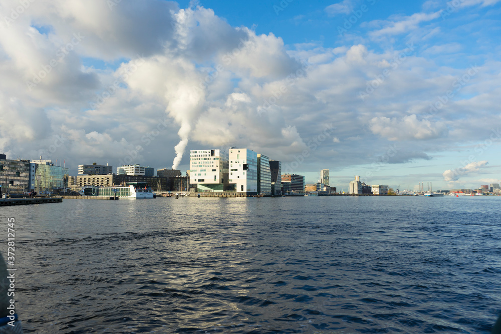 Landscape view of Amsterdam, Gerechtshof Amsterdam building and the harbor named Het IJ in Amsterdam, Netherlands