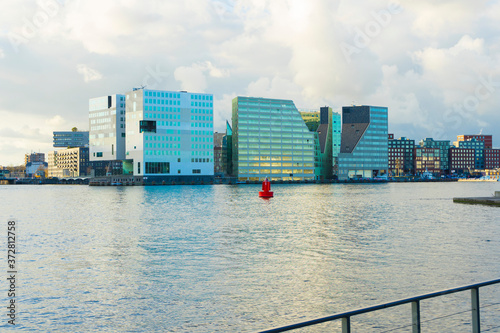 Landscape view of Amsterdam, Gerechtshof Amsterdam building and the harbor named Het IJ in Amsterdam, Netherlands photo