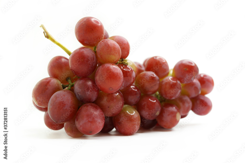 Close-Up Of Red Grapes Against White Background