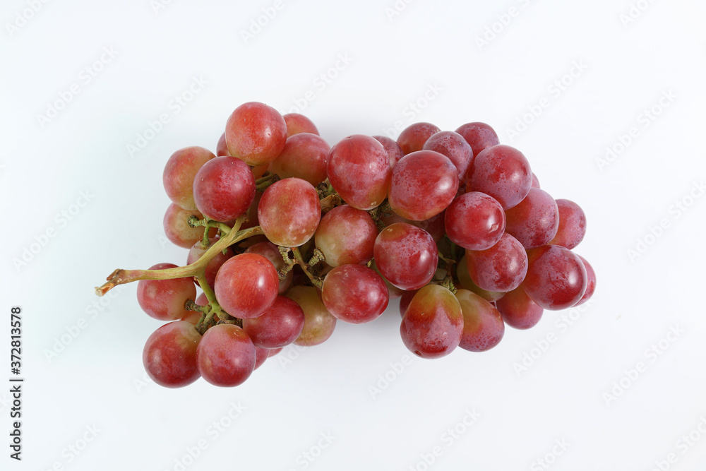 Close-Up Of Red Grapes Against White Background