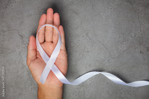 White ribbon symbol of peace International day of non violence. photo