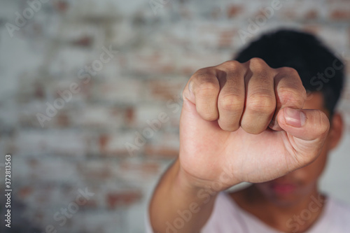 Young male boy making hand stop sign International day of non violence. photo