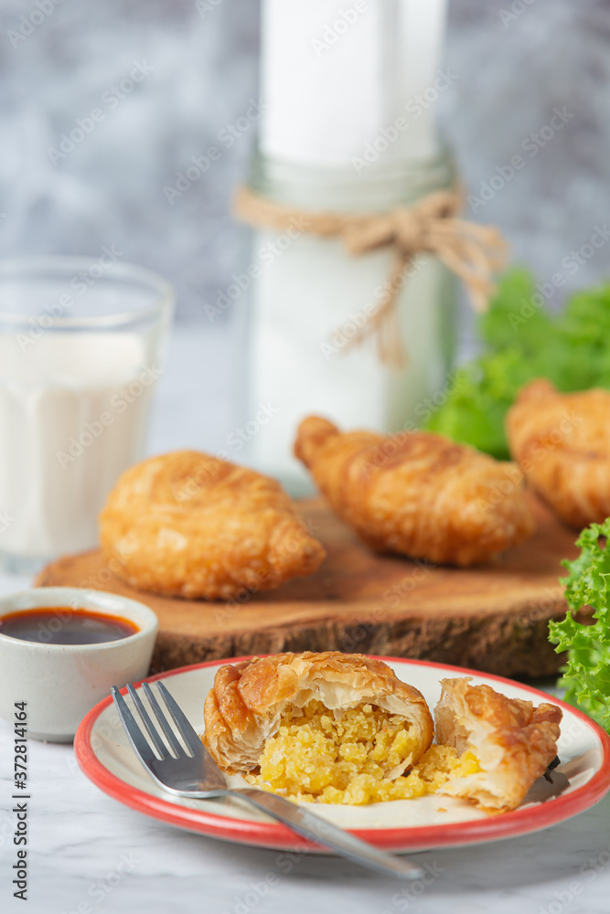 Stuffed chicken curry puffs on the table fall beautifully. Stuffed chicken curry puffs on the table fall beautifully.