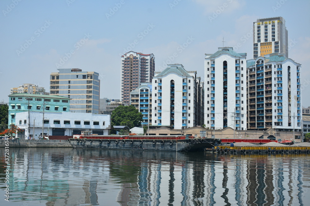 Fototapeta premium Neighboring buildings cityscape at Pasig river in Manila, Philippines