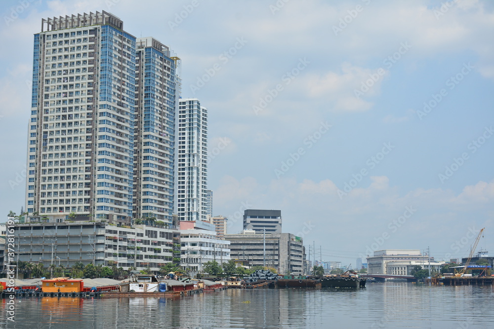 Neighboring buildings cityscape at Pasig river in Manila, Philippines