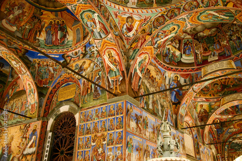 Rila, Bulgaria - Jan 29, 2007: Outer corridor with beautiful frescoes in the Rila Monastery photo