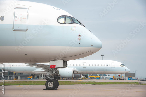 Due to Coronavirus Covid-19 airline fleet parked at the taxiway of Airport 