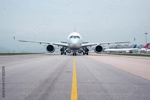 Due to Coronavirus Covid-19 airline fleet parked at the taxiway of Airport 