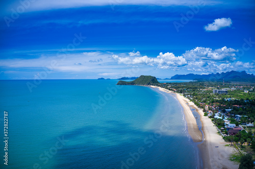 This unique photo shows the beach at Pak Nam Pran in Thailand photographed from above. You can see the sea and a mountain formation in the background