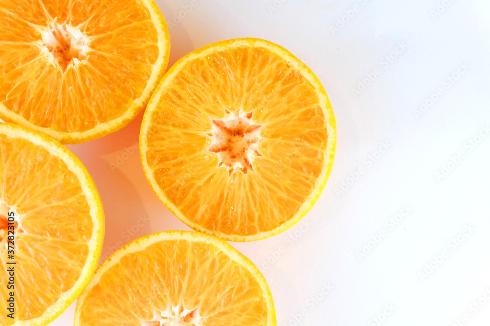 slices of orange on white