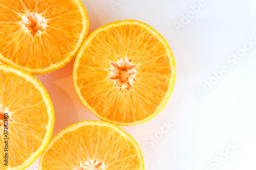 slices of orange on white