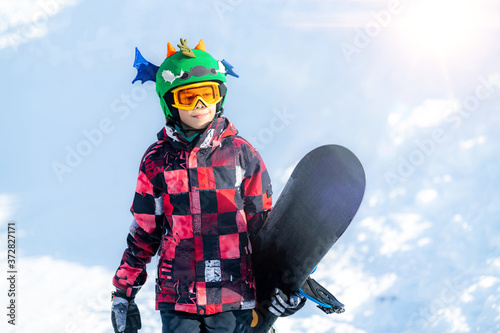 Portrait of Boy with Snowboard