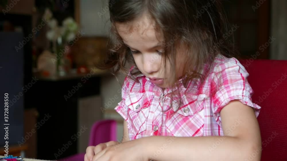 Little kid girl plays with puzzle game Little kid girl plays with puzzle game