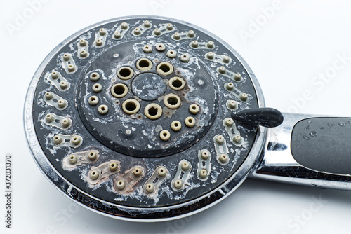Fotografía Silver shower head with limescales isolated on white background