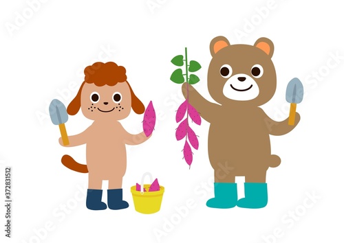 芋掘りで大収穫　たくさんのサツマイモを掘って喜んでいるクマと犬