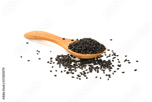 Hairy basil seeds in wooden spoon isolated on white background