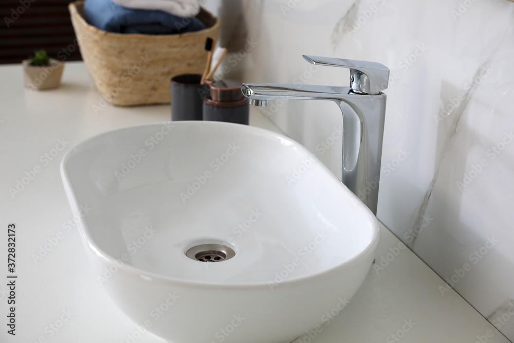 Stylish vessel sink on bathroom counter. Interior design Stylish vessel sink on bathroom counter. Interior design