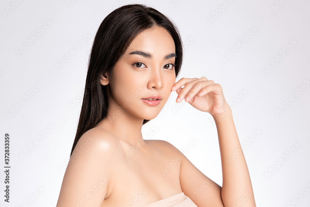 Beautiful Young asian Woman with Clean Fresh Skin, on white background, Face care, Facial treatment, Cosmetology, beauty and spa, Asian women portrait Beautiful Young asian Woman with Clean Fresh Skin, on white background, Face care, Facial treatment, Cosmetology, beauty and spa, Asian women portrait