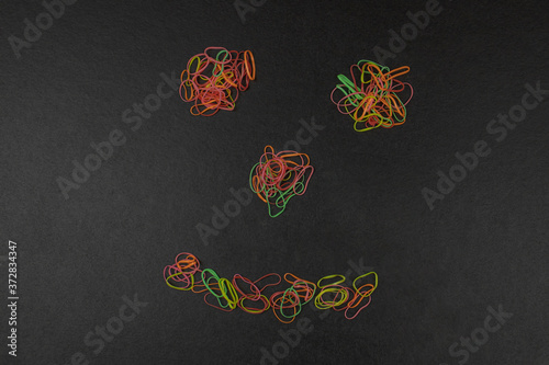 small rubber band colorful on black