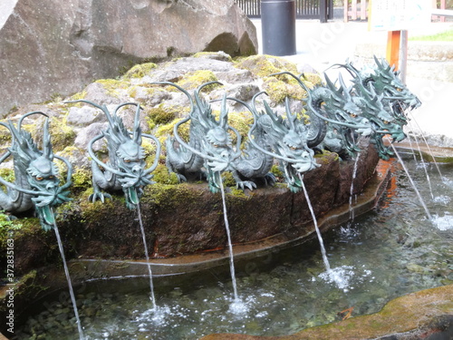恋愛祈願・竜の口から流れ出る龍神水、神奈川県箱根神社境内/God dragon spit water at Hakone shrine, Japan