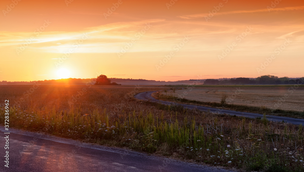 Country road and Sunrise in the French Gatinais regional nature park