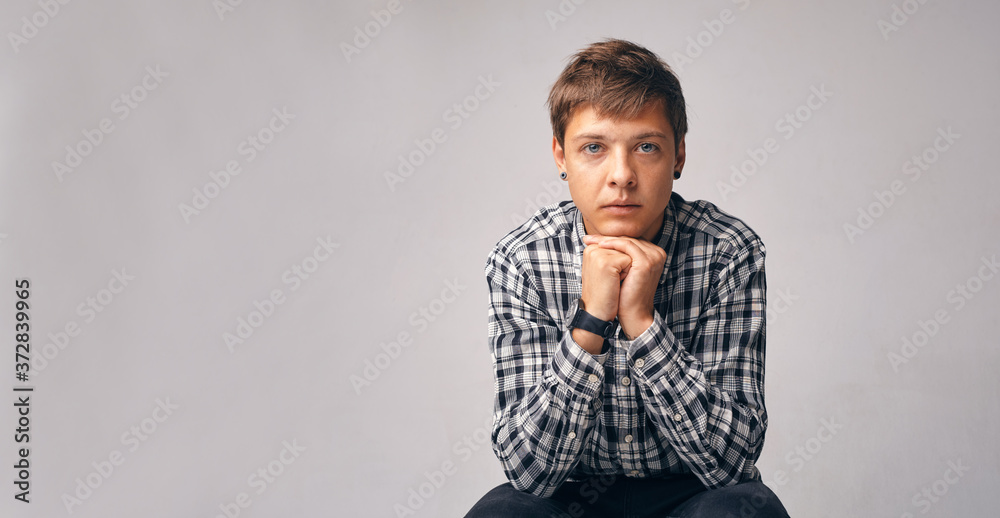 Stylish young man. Office worker. Sexy man standing and looking at the camera Stylish young man. Office worker. Sexy man standing and looking at the camera