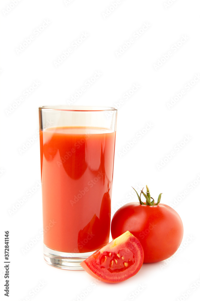 Fresh tomatoes and a glass full of tomato juice. Fresh tomatoes and a glass full of tomato juice.