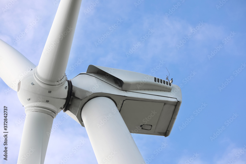 Wind turbine against beautiful sky, closeup. Alternative energy source Wind turbine against beautiful sky, closeup. Alternative energy source