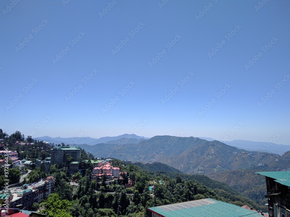 Fototapeta premium captured beautiful mountain range of Simla with mobile camera
