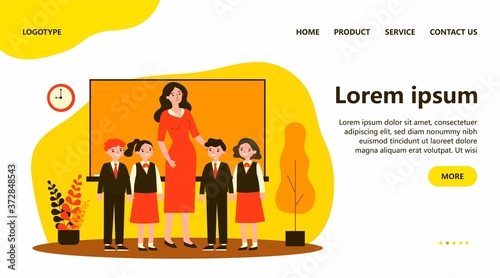 Happy children and teacher standing together in classroom. Class, classmates, pupils flat vector illustration. Primary school, education concept for banner, website design or landing web page