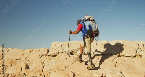 Wallpaper Mural Mixed race man with prosthetic leg hiking in nature Torontodigital.ca