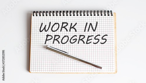 Canvas Print Handwriting text WORK IN PROGRESS on notepad