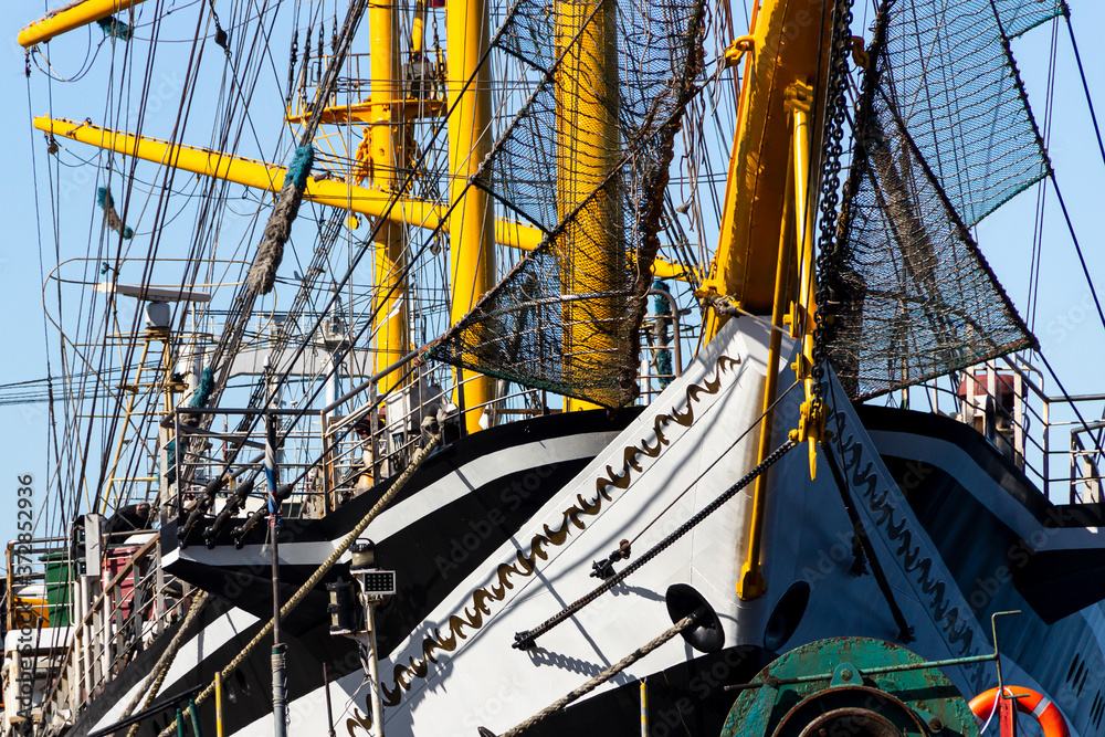 Rigging equipment of a sailing ship on a summer sunny day against a blue sky.