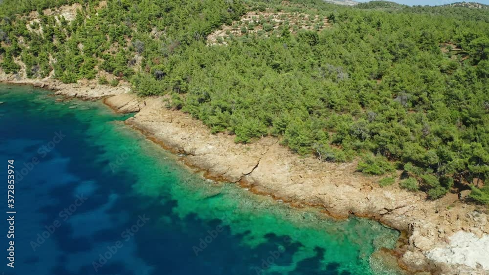 Cinematic aerial shot of Mediterranean coastline and sea at the island of Greece. Cinematic aerial shot of Mediterranean coastline and sea at the island of Greece.