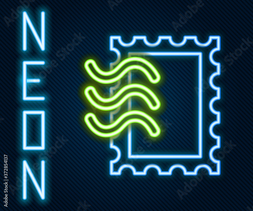 Glowing neon line Postal stamp icon isolated on black background. Colorful outline concept. Vector Illustration.
